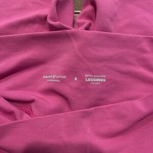 cross in the front pink cloth leggings